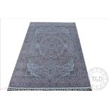 A Kashmir bamboo silk carpet, worked with an elaborate floral design against a lavender ground,