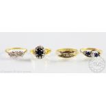 A collection of four rings, to include; a three stone diamond ring,
