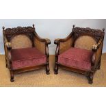 A 1920's carved walnut three piece bergere suite, comprising three seater settee and two chars,