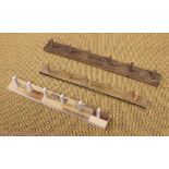 Three treen vintage style coat rails, two six peg and one five peg,