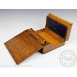 A Victorian golden oak desk top writing box,