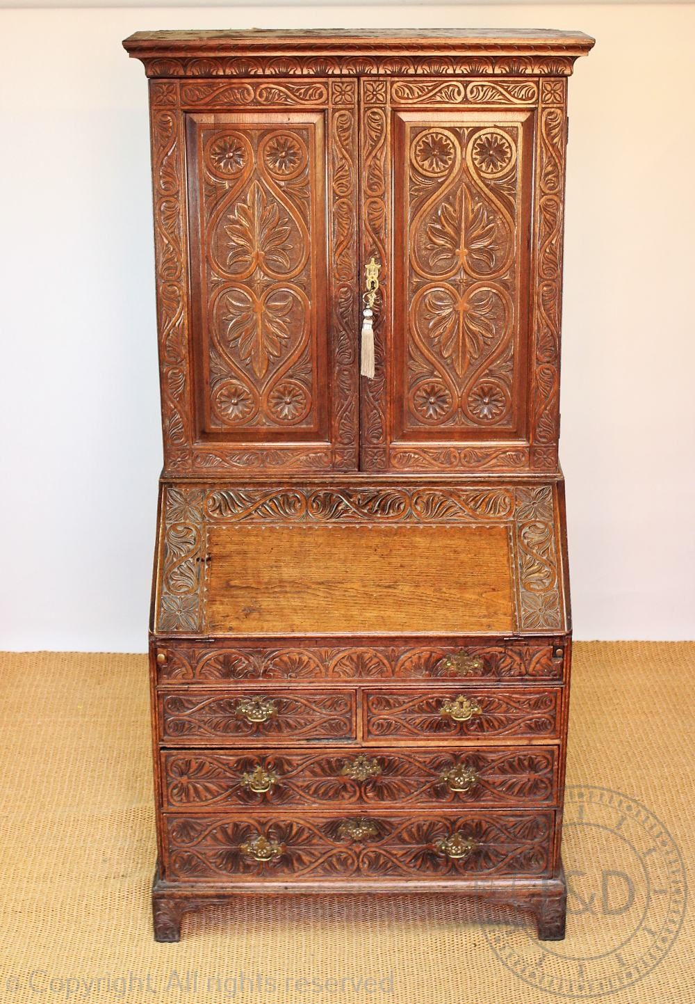 A late George III oak bureau bookcase with later carved detailing, possibly Welsh, - Image 2 of 2