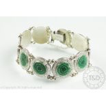 An enamelled bracelet stamped 'Silver', designed as ten circular links,