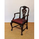 A Victorian carved mahogany carver dining chair, with fancy splat and drop in upholstered sear,