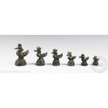 A graduated set of six bronze opium weights, 19th century, each modelled as a Hintha bird,