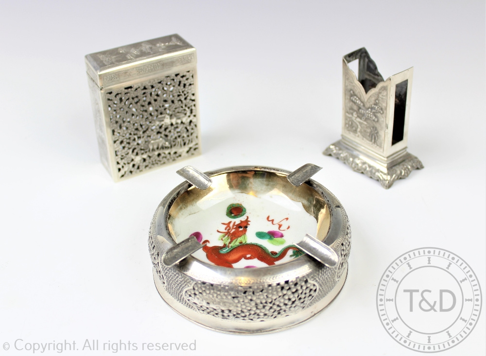 A Vietnamese '900' standard silver smoking set comprising; a rectangular cigarette holder, 8cm high,