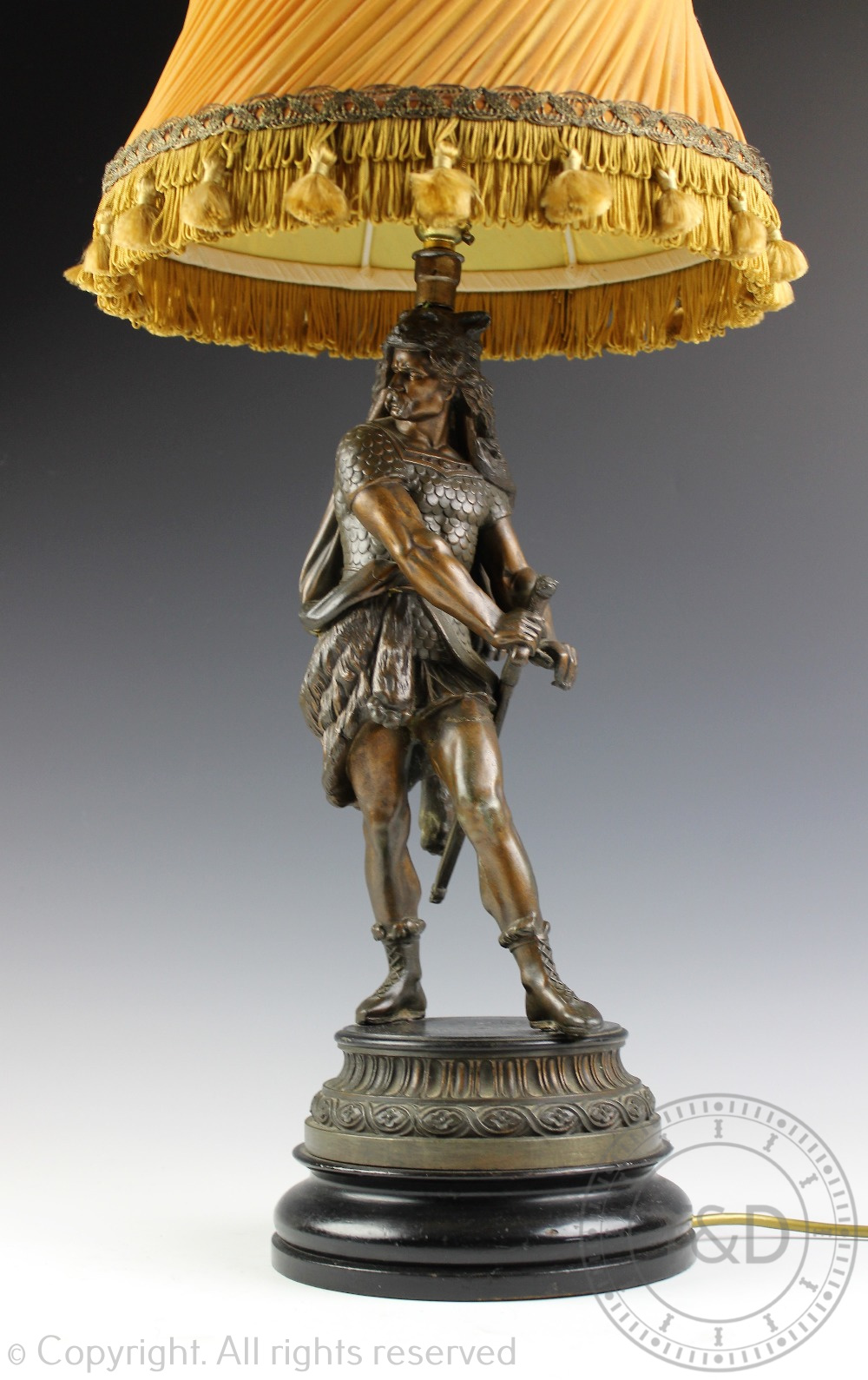 A late 19th century bronzed spelter figural table lamp, modelled as a Viking warrior,