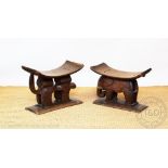 Two African Ashanti zoomorphic stools, each carved as a stylised feline and an elephant,