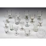 A collection of 19th century and later glasses and measures including wine, liqueur,