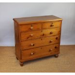 A late Victorian pine chest, of two short and three long drawers, on turned feet,