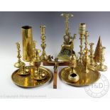 A large selection of assorted brass and altar wares, to include; a stag door porter 40cm high,