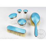 An Art Deco silver and turquoise guilloche enamel dressing table set, Lionel Smith & Co,