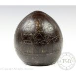 A 19th century carved coconut shell,