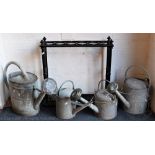 A collection of four galvanized garden watering cans, tallest 42cm,