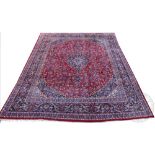 A large Persian Kashan wool carpet,