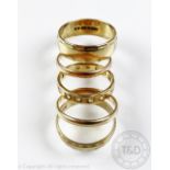 A collection of four 9ct yellow gold rings,