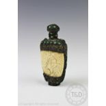 A Chinese white metal and bone snuff bottle and stopper, inlaid with green stone cabochons,