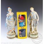 A pair of Austrian classical bisque figures,