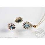 An aquamarine set pendant and matching earrings, each of pear shape and set in 9ct gold,