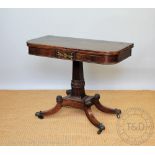 A Regency brass inlaid rosewood card table, with fold over swivel top, on a carved square column,