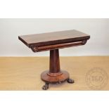 An early Victorian mahogany tea table,