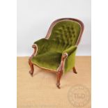 A Victorian carved mahogany salon chair, with button back green upholstery, on cabriole legs,
