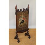 An elaborate mid 19th century Welsh carved oak fire screen, of gothic form,