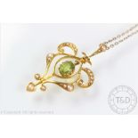 An Edwardian peridot and seed pearl set pendant,