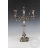 A late Victorian silver plated five light candelabrum, cast with flowers and scrolls,