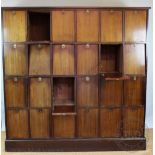 An early 20th century walnut solicitors bank of cabinets,