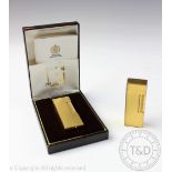 A cased Dunhill lighter, engine turned decoration throughout and numbered 'US RE 24163 Patented,