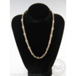 An unusual 9ct gold necklace and matching bracelet,