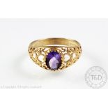 An amethyst set 9ct yellow gold ring,
