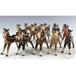 Four Beswick Shetland foals, model number 1034, designed by Arthur Gredington, 9.