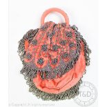 A 1920's ladys cut metal and coral coloured velvet evening purse, decorated with flowers, 16cm,