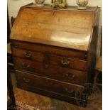 A George III oak provincial style bureau,