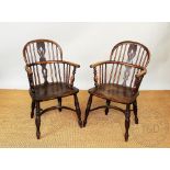 A pair of 19th century ash and elm Windsor chairs, with hoop backs and solid seats,