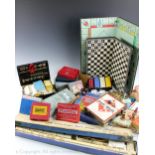A collection of vintage playing cards, board games, counters, etc,