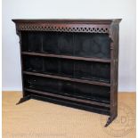 An early 19th century Welsh oak dresser top / plate rack, with pierced frieze and three shelves,