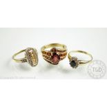 A 9ct gold garnet set dress ring along with a cz set oval cluster ring in 9ct gold and a diamond