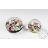 Two millefiori cane work glass paperweights,