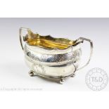A George III silver sugar bowl London 1808, of oval two handled form,