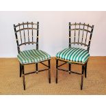 A pair of 19th century Aesthetic chairs, gilt decorated ebonised spindle frames, on turned legs,
