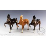 Three Beswick Arab horses (head tucked, leg up), model number 1549, designed by Pal Zalmen,