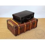 A vintage canvas and wooden bound travelling steamer trunk, 84cm wide,