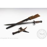 A British hooked quillon bayonet dated 1907 in scabbard,
