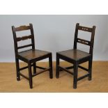 Four early 19th century Welsh oak dining chairs, with differing back and solid seats,