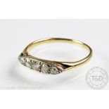 A five stone diamond ring, the graduated stones all within boat shaped setting,