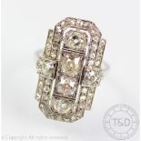 An Art Deco diamond ring circa 1925, the vertically set ring designed as four old cut diamonds,