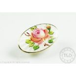 A David Andersen enamelled rose brooch, the oval panel depicting a pink bloom, in silver gilt,
